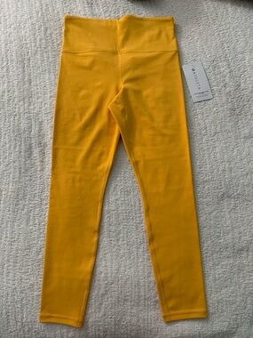 NWT. Athleta Bright Yellow Ultra High Rise Elation 7/8 Tight Leggings size Small